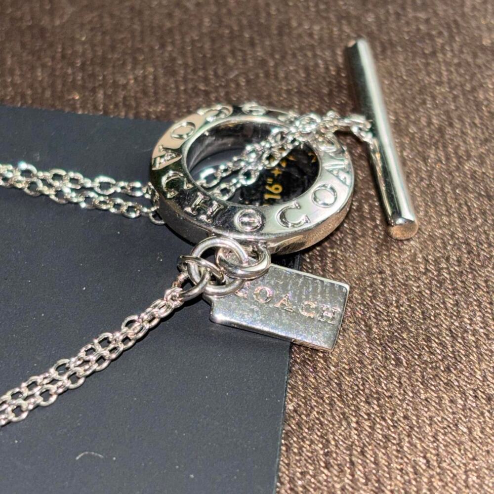 COACH necklace 16-18” Silver Tone Signature Logo Multi Charm Pendant